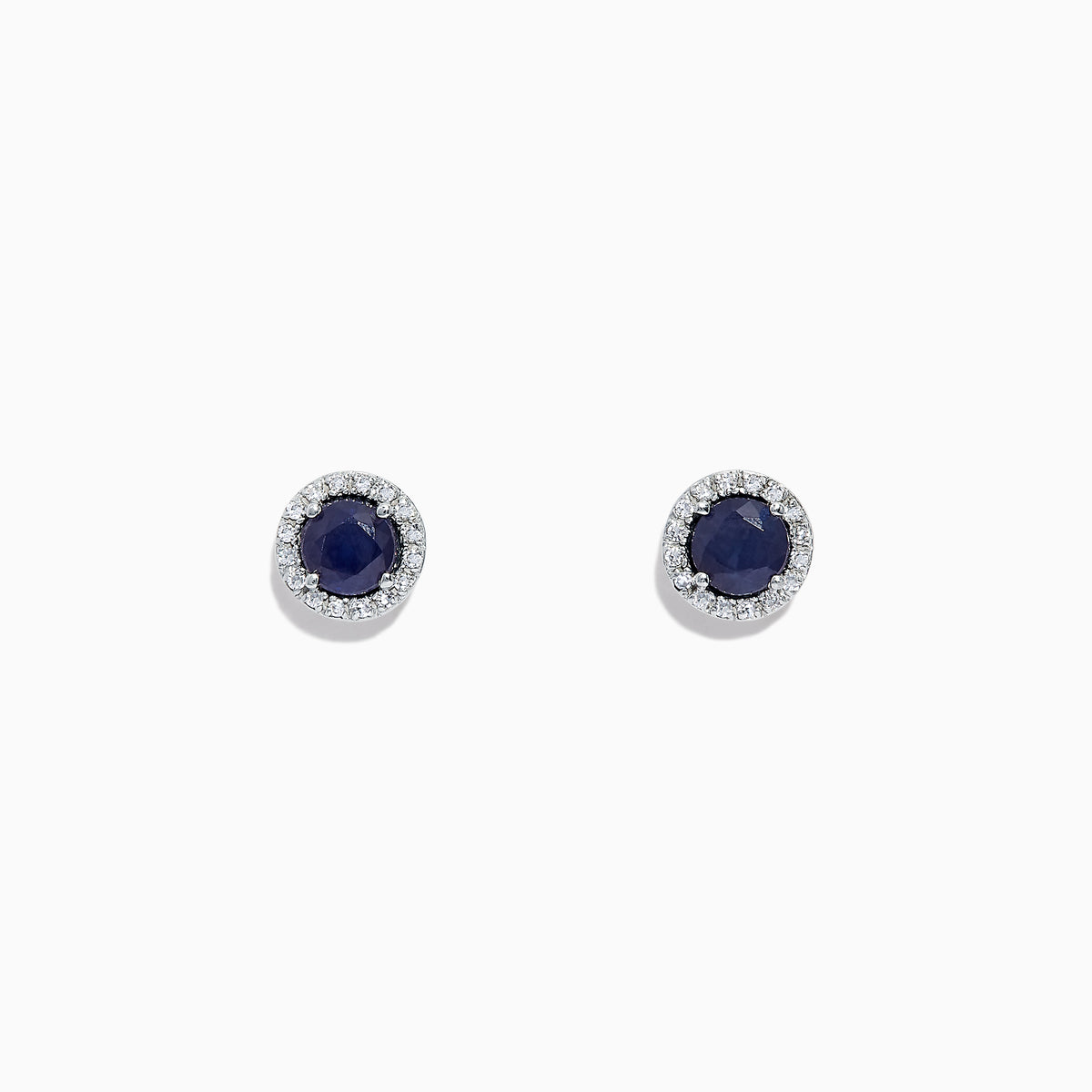 The Royale Bleu 14K White Gold Sapphire & Diamond Stud Earrings, 1.27 TCW, feature deep blue round sapphires encircled by a halo of diamonds and are shown on a white background.
