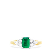 The Brasilica 14K 2-Tone Gold Emerald and Diamond Ring (1.36 TCW) features a rectangular green emerald center, accented by three round white diamonds on each side in a symmetrical design.