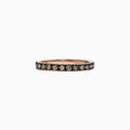 The 14K Rose Gold Brown Diamond Stacking Ring, 0.65 TCW, showcases a full circle of round brown diamonds in a channel setting, perfect for stacking and shown against a white backdrop.