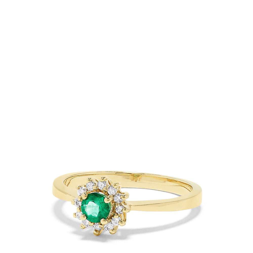The 14K Yellow Gold Emerald and Diamond Ring, 0.36 TCW, showcases a round emerald center accented by a floral halo of sparkling white diamonds.