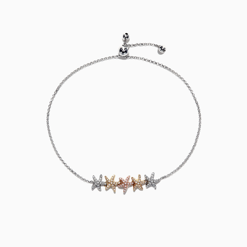 The Seaside 14K Tri Color Gold Diamond Starfish Bracelet features five diamond-encrusted starfish charms in silver, gold, and rose gold tones, arranged symmetrically along an adjustable chain. Total carat weight: 0.28 TCW.