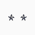 The Seaside 14K White Gold Sapphire & Diamond Starfish Stud Earrings (0.71 TCW) feature blue sapphires and diamonds in a starfish design, shown against a plain white background.