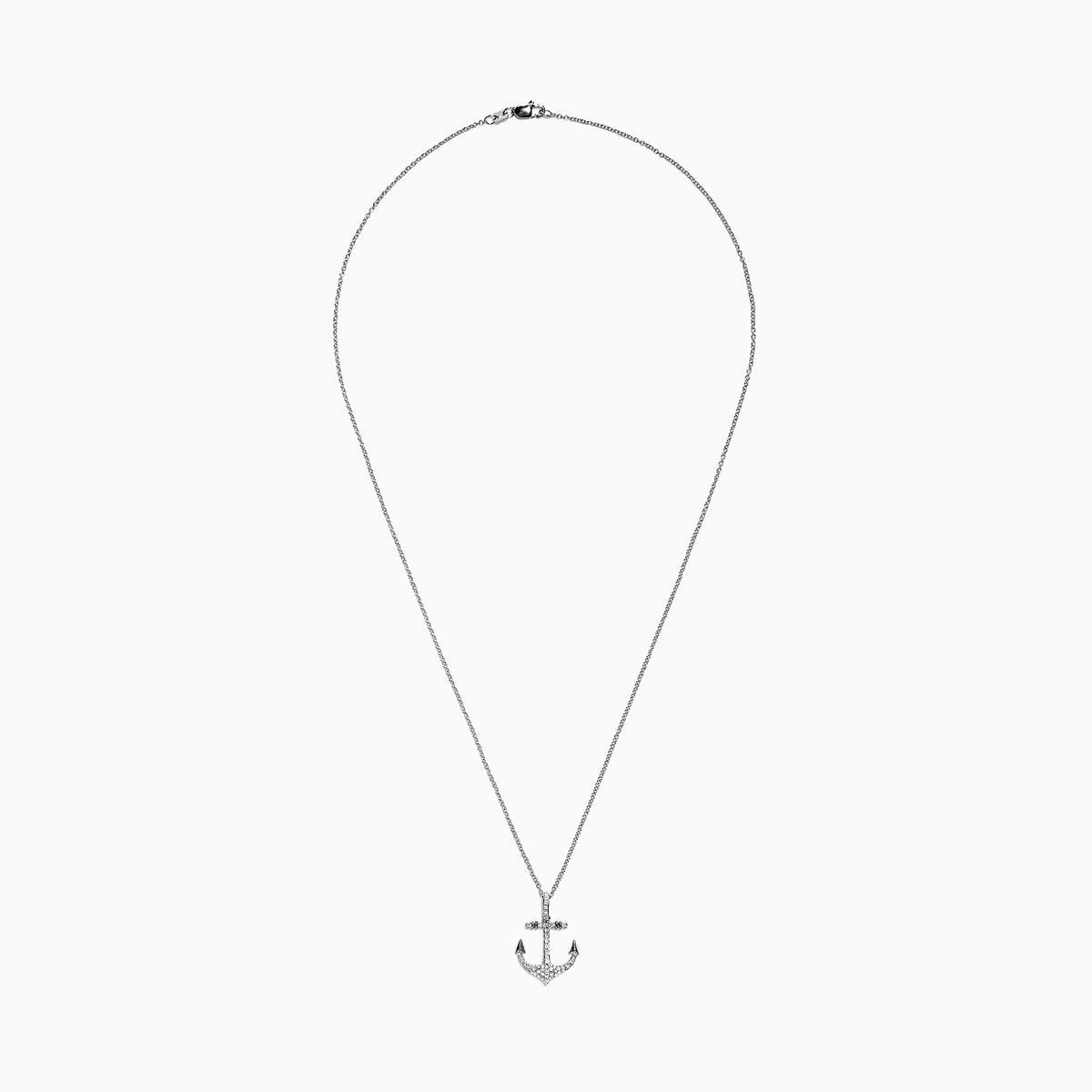 A Seaside 14K White Gold Diamond Anchor Pendant (0.21 ct) is displayed on a plain white background, its silver design encrusted with sparkling diamonds.