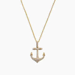 The Seaside 14K Yellow Gold Diamond Anchor Pendant (0.21 TCW) features sparkling diamonds and gold detailing at the tips and crossbar, creating a radiant anchor design against a plain white background.