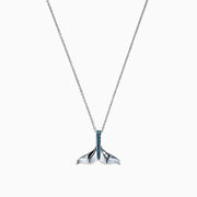 The Seaside 14K White Gold Blue Diamond Whales Tail Pendant (0.05 TCW) features a sparkling row of blue diamonds along the center, complemented by a thin chain and polished finish for an elegant, ocean-inspired look.