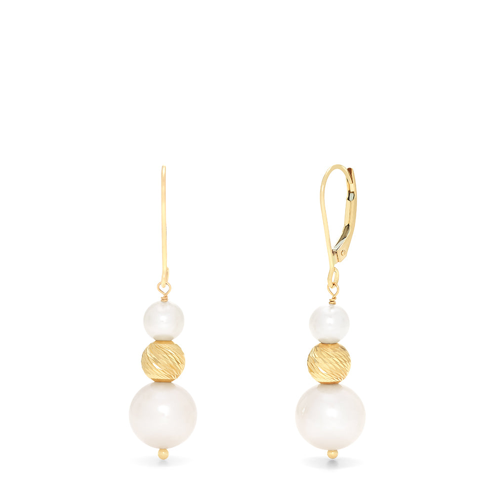 The 14K Yellow Gold Cultured Fresh Water Pearl Earrings feature yellow gold hooks, a textured gold bead, and two freshwater pearls—one small above and one larger below the bead—dangling from each earring.