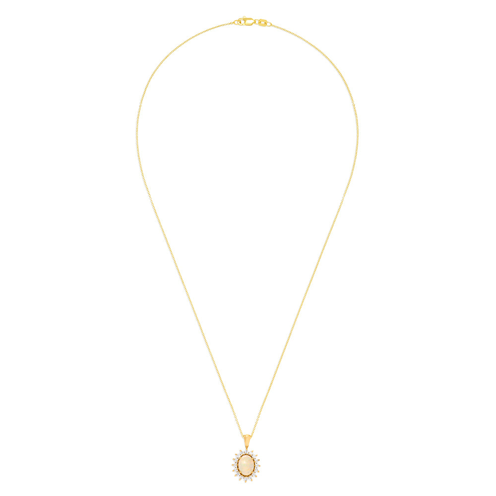 The Aurora 14K Yellow Gold Opal and Diamond Pendant (1.28 TCW) features an oval opal and diamond centerpiece, framed by sparkling round white stones in a radiant sunburst design on a yellow gold chain necklace.