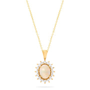 The Aurora 14K Yellow Gold Opal and Diamond Pendant (1.28 TCW) features an oval opal and diamond centerpiece, framed by sparkling round white stones in a radiant sunburst design on a yellow gold chain necklace.