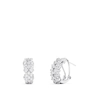 A pair of 925 sterling silver diamond earrings, featuring three rows of sparkling round diamonds totaling 0.33 TCW, shown against a plain white background.