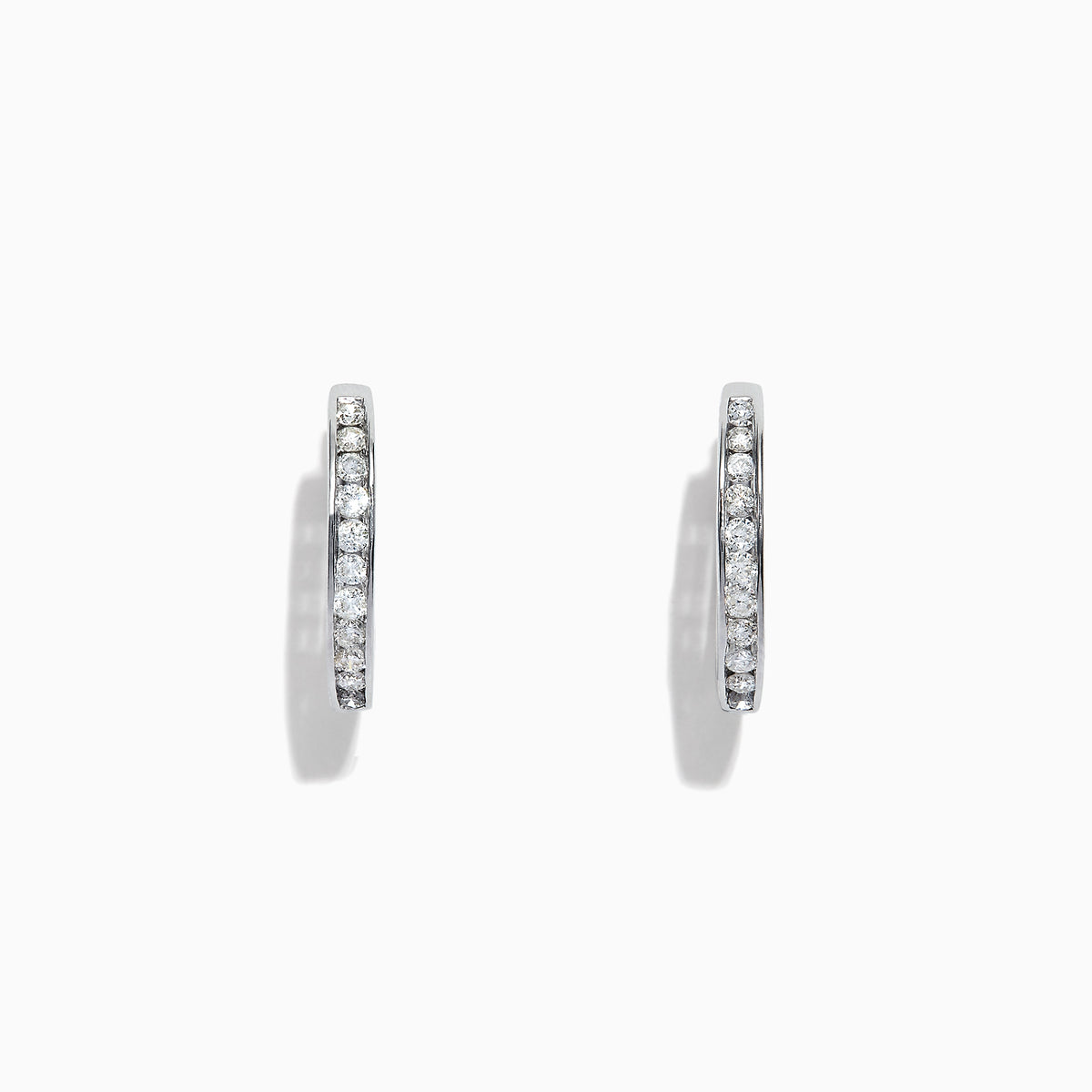 The Pave Classica 14K White Gold Channel-Set Diamond Hoop Earrings, 0.48 TCW, feature small round diamonds encrusted in a channel-set design along the outer edge, shown against a plain white background.