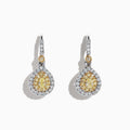 The Canare 18K Two-Tone Gold Double Halo Pear Shaped Yellow Diamond Earrings, 0.99 TCW, feature elegant teardrop-shaped yellow diamonds surrounded by double halos of white diamonds for timeless sparkle and sophistication.