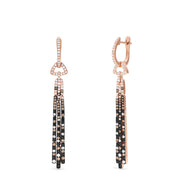 Elevate your style with these 14K Gold Black, Espresso & White Diamond Tassel Drop Earrings (1.51 TCW), featuring dangling segments and sparkling diamonds in geometric patterns for a sophisticated look.