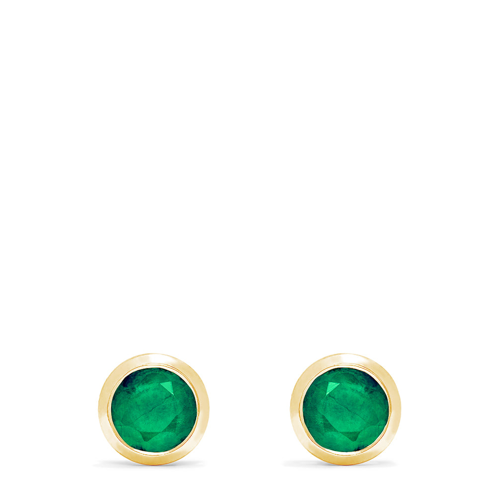 A pair of Brasilica 14K Yellow Gold Emerald Stud Earrings, 0.95 TCW, with round studs set in yellow gold bezels, displayed against a white background.