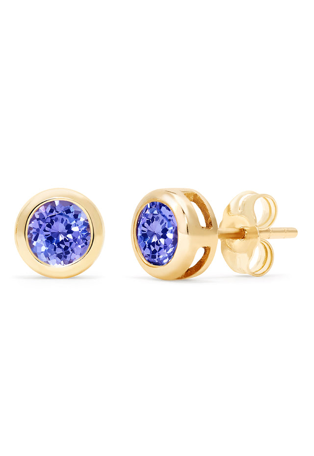 A pair of 14K Yellow Gold Tanzanite Stud Earrings, 0.91 TCW, with round faceted stones in classic bezel settings, shown on a white background.