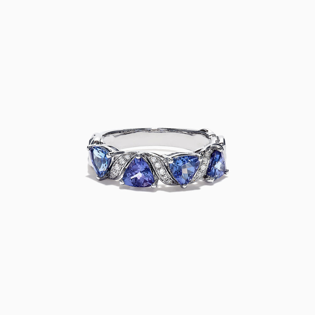 The Nahla Siri 14K White Gold Tanzanite Diamond Ring, 1.58 TCW, features three heart-shaped blue tanzanites set among wavy silver and diamond accents, shown on a white background.