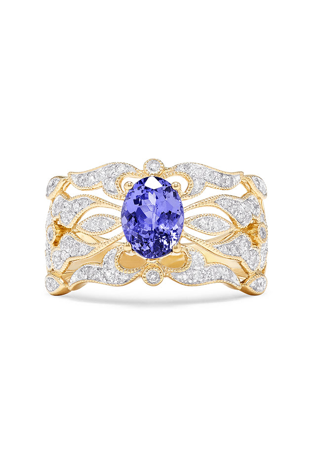 The 14K Yellow Gold Tanzanite and Diamond Ring, 1.45 TCW, showcases a large oval tanzanite center with shimmering white diamonds along the intricately designed openwork band.