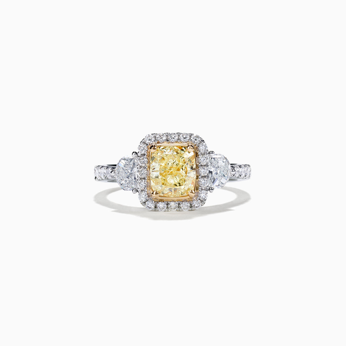 The Canare 18K Two-Tone Gold Cushion Cut Yellow Diamond Ring features a 2.19 TCW yellow center stone with a white diamond halo, two large side diamonds, and sparkling accents along the shank.