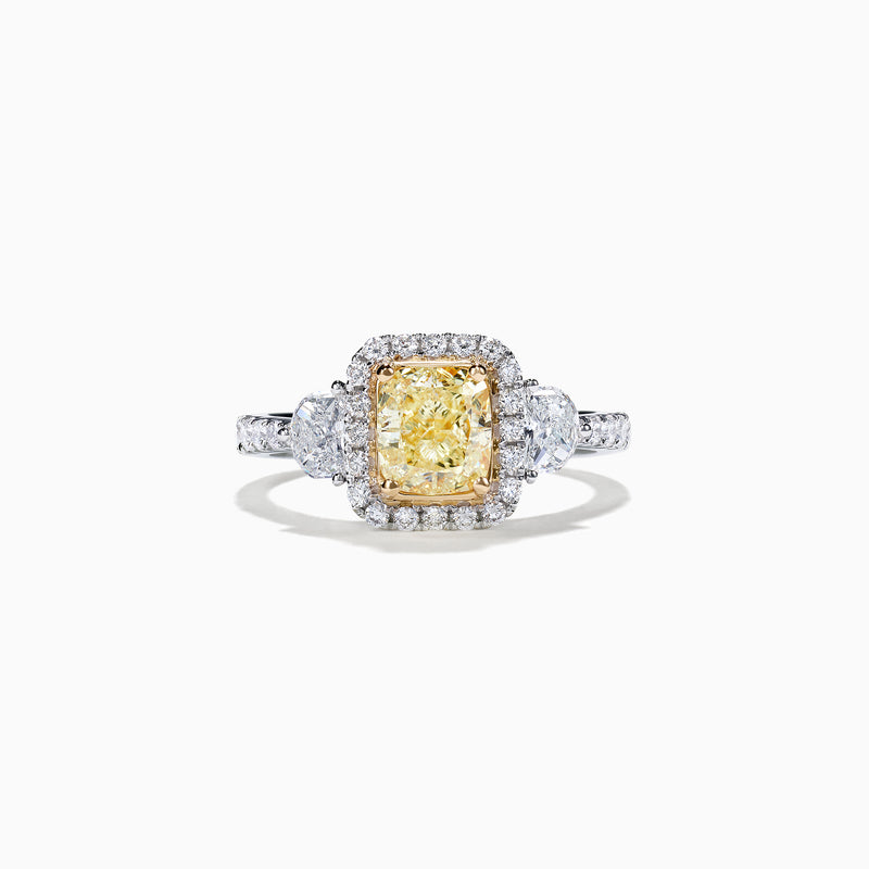 The Canare 18K Two-Tone Gold Cushion Cut Yellow Diamond Ring features a 2.19 TCW yellow center stone with a white diamond halo, two large side diamonds, and sparkling accents along the shank.