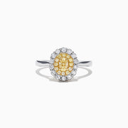 The Canare 18K Two-Tone Gold Oval Double Halo Yellow Diamond Ring, 0.65 TCW, features a central oval yellow diamond cluster and twin white diamond halos, elegantly set against a plain white background.