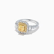The Canare 18K Two-Tone Gold Cushion Cut Yellow Diamond Ring (1.98 TCW) features a double halo of white diamonds and a diamond-accented band, shown against a white background.