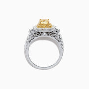 The Canare 18K Two-Tone Gold Cushion Cut Yellow Diamond Ring (1.98 TCW) features a double halo of white diamonds and a diamond-accented band, shown against a white background.
