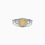 The Canare 18K Two-Tone Gold Cushion Double Halo Yellow Diamond Ring, 0.96 TCW, features a cushion-cut yellow diamond with a double white diamond halo and diamonds set along the band.
