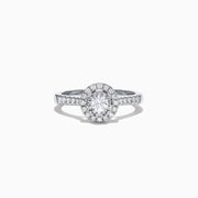 The Pave Classica 14K White Gold Diamond Halo Ring, 0.59 TCW, showcases a brilliant round center stone with a double halo and diamonds along the band, all elegantly set in white gold and displayed on a white background.
