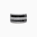 The 14K White Gold Black and White Diamond Ring, 2.48 TCW, features alternating rows of rectangular black and white diamonds in a sleek band, elegantly displayed against a white background.