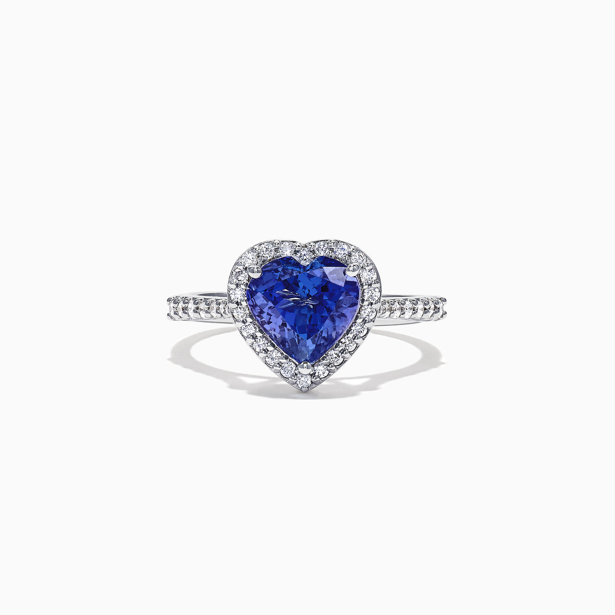 The Nahla Siri 14K White Gold Tanzanite and Diamond Heart Ring, 2.38 TCW, features a heart-shaped blue tanzanite center surrounded by a halo of diamonds and additional diamonds set along the band.