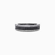 The 14K White Gold Black and White Diamond Band Ring, 1.06 TCW, showcases a row of rectangular black diamonds framed by two rows of round white diamonds on a sleek white gold band.