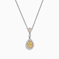 The Canare 18K Two-Tone Gold Yellow and White Diamond Pendant (0.74 TCW) is a silver necklace featuring a teardrop design with yellow gemstones and white diamonds, both surrounded by halos of sparkling stones for added elegance.