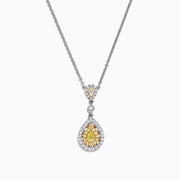The Canare 18K Two-Tone Gold Yellow and White Diamond Pendant (0.74 TCW) is a silver necklace featuring a teardrop design with yellow gemstones and white diamonds, both surrounded by halos of sparkling stones for added elegance.