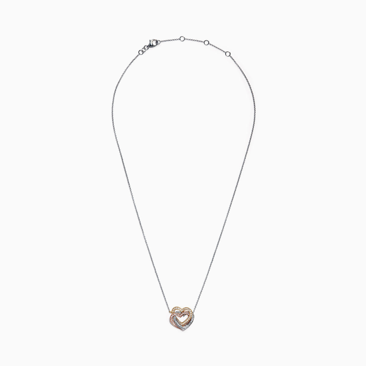 An elegant Trio 14K Tri Color Gold Diamond Heart Necklace, 0.40 TCW, features a thin chain with three interlocking hearts in silver, gold, and rose gold tones for a sparkling, timeless look.