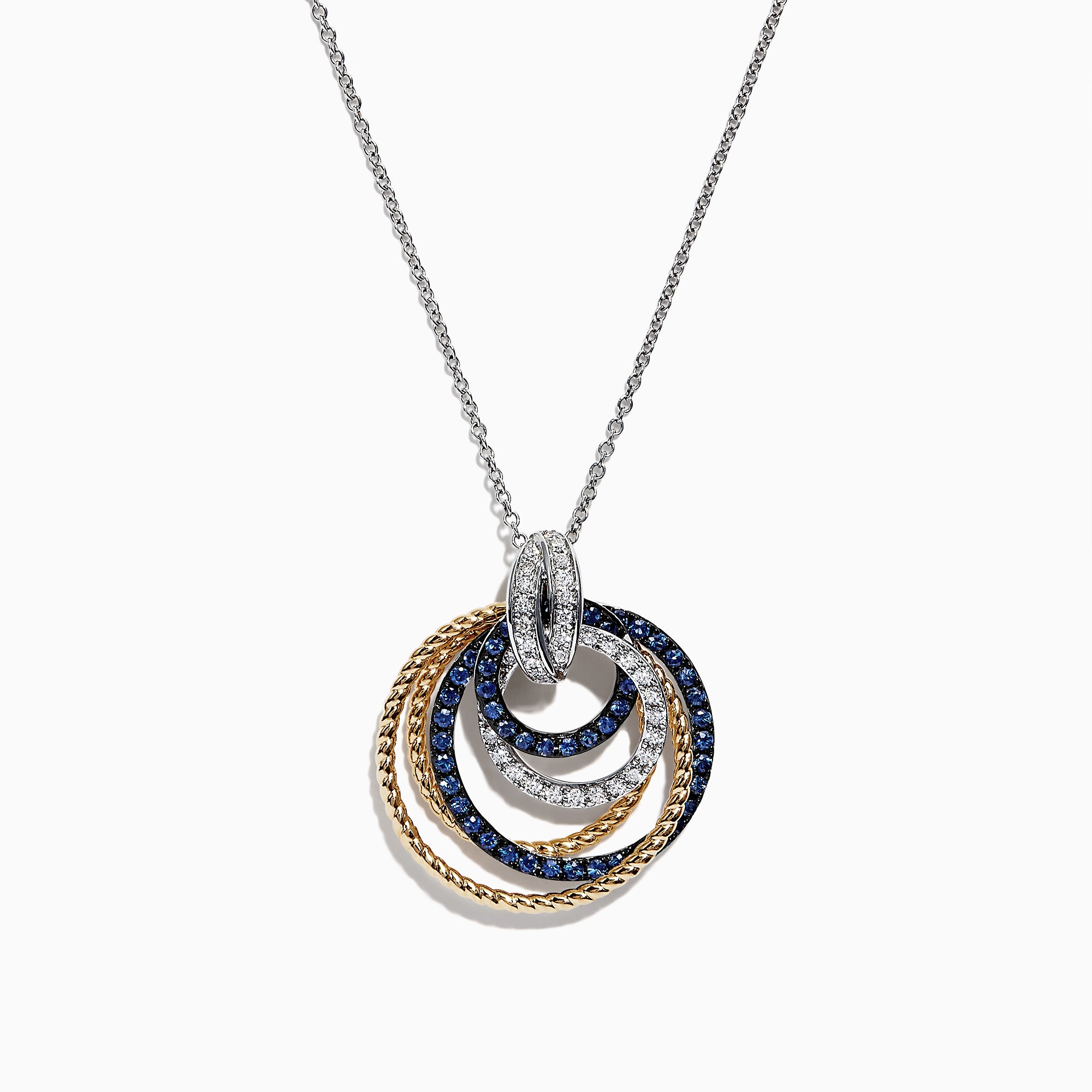 The Royale Bleu 14K 2-Tone Sapphire and Diamond Circles Pendant (1.09 TCW) features interlocking textured circles in gold and silver, encrusted with sapphires and diamonds, elegantly hanging from a delicate silver chain.