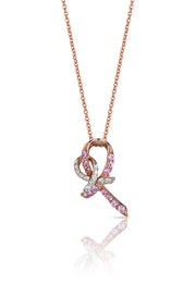 The 14K Rose Gold Pink Sapphire and Diamond Breast Cancer Awareness Ribbon Pendant (0.31 TCW) features a ribbon-shaped design adorned with pink sapphires and diamonds, symbolizing breast cancer awareness, on a white background.