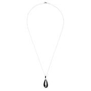 This 14K white gold pendant features a teardrop design accented with black diamonds on the inner curve and sparkling white diamonds on the outer edge, totaling 0.86 TCW for striking contrast.