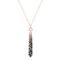 The Confetti 14K Gold Pendant features black, espresso, and white diamonds (1.17 TCW) on a long rose gold chain with a gold pendant accented by geometric details and three black tassels adorned with clear gemstones.
