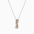 The 14K two-tone gold crossover pendant features a twisting ribbon design with brown and white diamond accents totaling 1.00 TCW, hanging from a delicate chain.