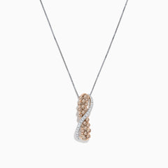 The 14K two-tone gold crossover pendant features a twisting ribbon design with brown and white diamond accents totaling 1.00 TCW, hanging from a delicate chain.