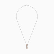 The 14K two-tone gold crossover pendant features a twisting ribbon design with brown and white diamond accents totaling 1.00 TCW, hanging from a delicate chain.