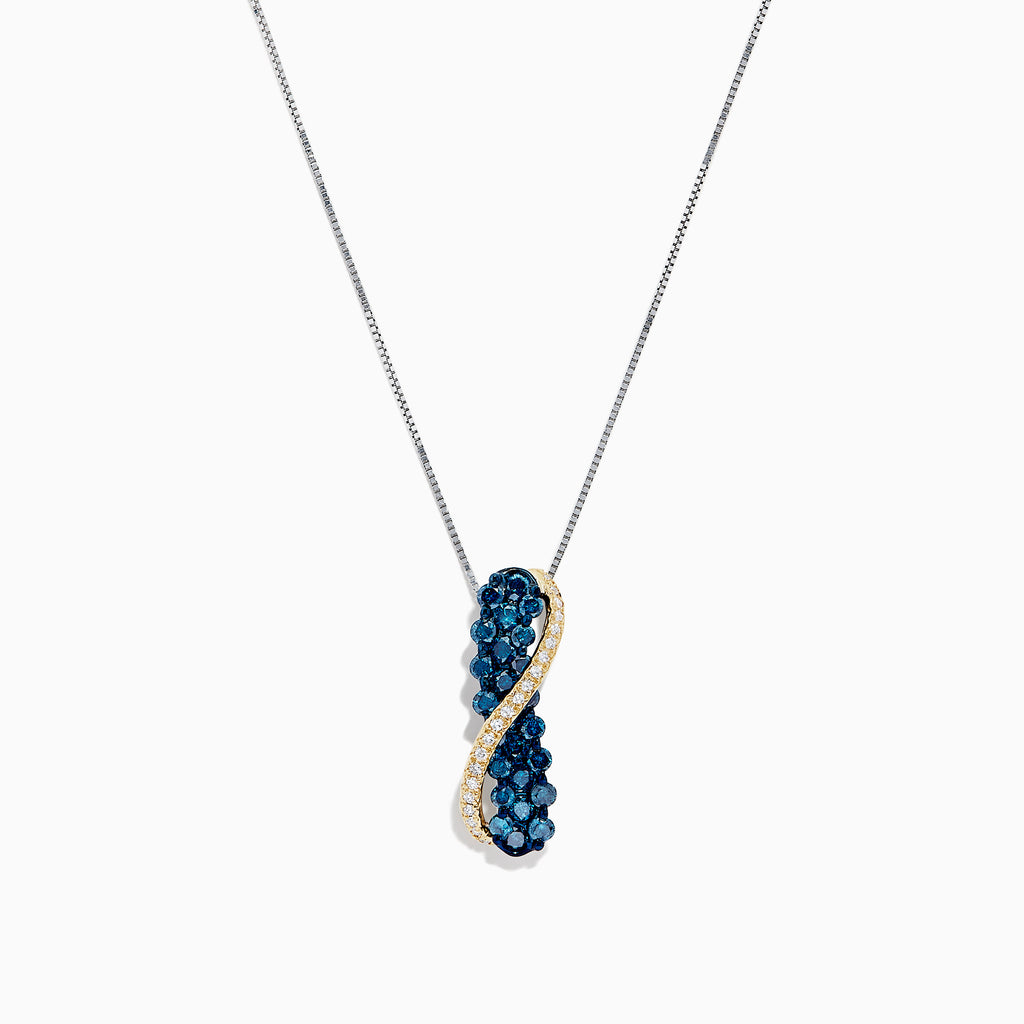 This 14K two tone gold necklace features a crossover pendant with blue and white diamonds (1.00 TCW) on one side, clear gemstones on the other, separated by a gold-toned wavy line.
