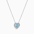 A 14K white gold pendant featuring a heart-shaped aquamarine surrounded by diamonds (2.90 TCW), displayed against a white background.