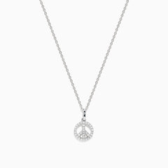 The 925 Sterling Silver Diamond Peace Sign Necklace features a delicate chain with a small, round pendant encrusted with clear, sparkling gemstones in the shape of a peace sign.