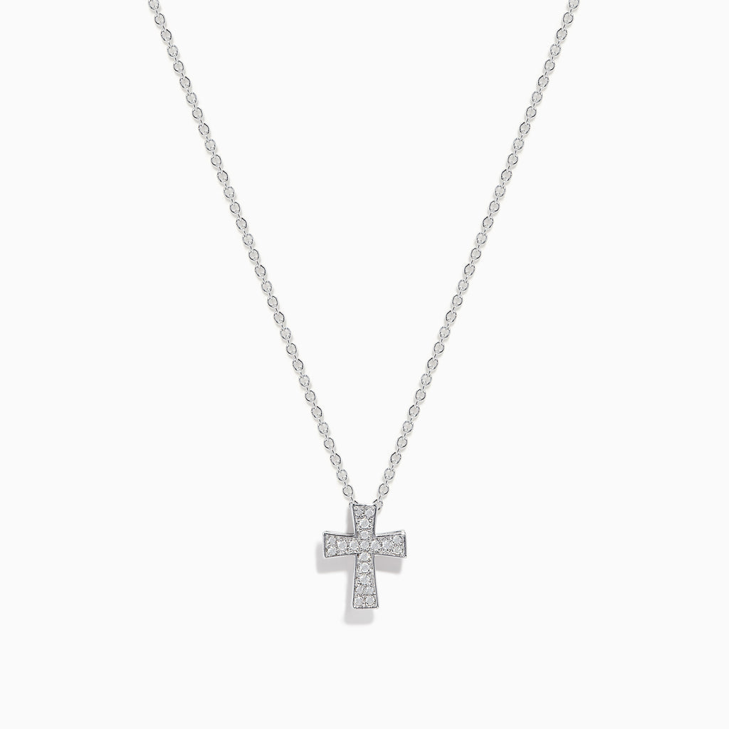 The 925 Sterling Silver Diamond Cross Pendant features a delicate silver chain with a small, sparkling diamond cross, encrusted with clear gemstones and displayed against a white background.