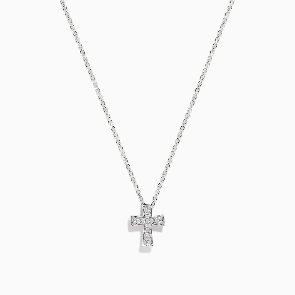 The 925 Sterling Silver Diamond Cross Pendant features a delicate silver chain with a small, sparkling diamond cross, encrusted with clear gemstones and displayed against a white background.