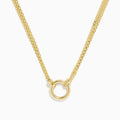 The 14K Yellow Gold 18 Charm Holder Necklace features two chains joined by a small gold ring pendant, adding a refined and elegant touch to any look.