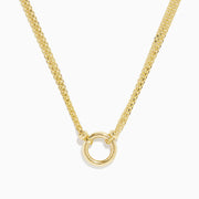The 14K Yellow Gold 18 Charm Holder Necklace features two chains joined by a small gold ring pendant, adding a refined and elegant touch to any look.