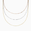 The 14K Tri Tone Gold Mirror Chain Necklace 17 features delicate oval and round links in rose gold, silver, and yellow gold tones, beautifully displayed against a white background.