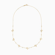 The 14K Yellow Gold Mini Butterflies Necklace features small, open butterfly charms spaced along a fine gold chain for a simple yet elegant design.