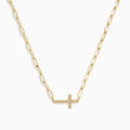 The 14K Yellow Gold West-East Cross Paperclip Chain Necklace 17 features a delicate paperclip chain and a small horizontal cross pendant, all crafted in 14K yellow gold.